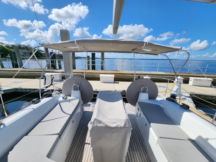 Just A Sign Yacht Photos Pics Beneteau Oceanis 40.1 yacht deck, 2022 model, docked with clear blue sky and water view.