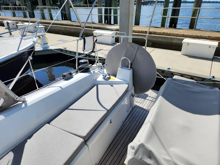 Just A Sign Yacht Photos Pics Beneteau Oceanis 40.1 yacht deck, 2022 model, docked at marina with seating area.