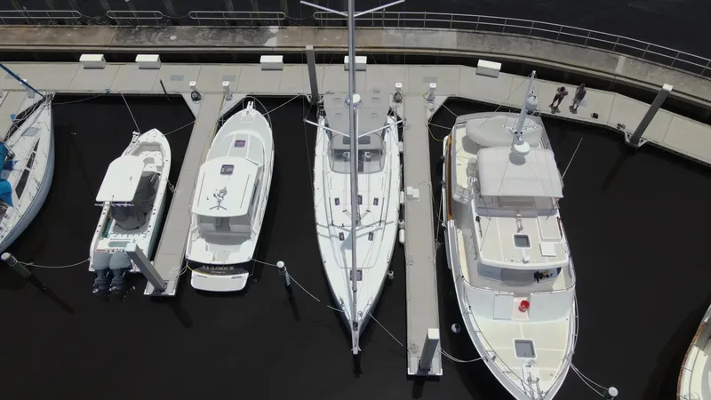 Just A Sign Yacht Photos Pics Aerial view of boats docked, featuring a 2022 Beneteau Oceanis 40.1 sailboat.