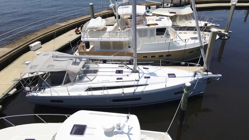 Just A Sign Yacht Photos Pics 2022 Beneteau Oceanis 40.1 yacht docked at marina, aerial view.