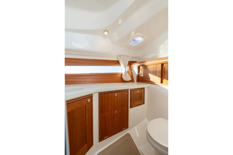 In-stock 2026 Mjm 3-053 Yacht Photos Pics 2026 MJM 3 yacht interior with wooden cabinets and compact bathroom design.