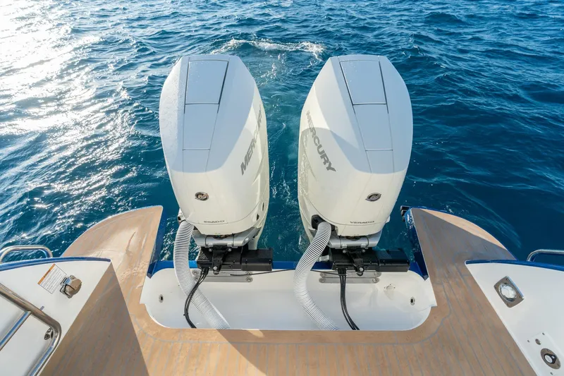 In-stock 2026 Mjm 3-053 Yacht Photos Pics Twin Mercury outboard engines on MJM 3 boat, 2026 model, cruising on blue ocean water.