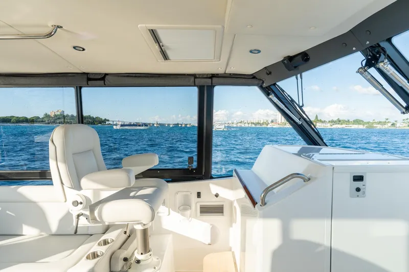 In-stock 2026 Mjm 3-053 Yacht Photos Pics Interior view of 2026 MJM 3 yacht, featuring a luxurious captain's chair and panoramic windows.
