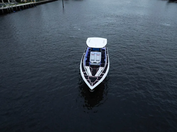 Heavy Metal Yacht Photos Pics Aerial view of 2017 Statement 380 Open boat on calm water.