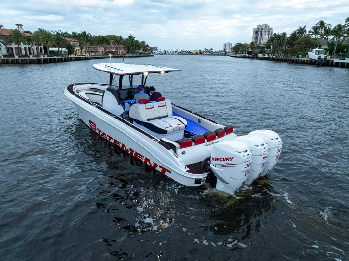 Heavy Metal Yacht Photos Pics 2017 Statement 380 Open boat cruising on a scenic waterway with powerful Mercury engines.