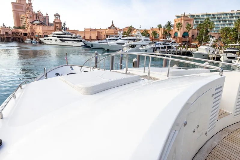 Benetti Classic Yacht Photos Pics Luxurious 2008 Benetti Classic yacht docked in a scenic marina with elegant architecture.