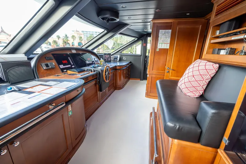 Benetti Classic Yacht Photos Pics Luxurious 2008 Benetti Classic yacht interior with wooden cabinetry and modern navigation equipment.