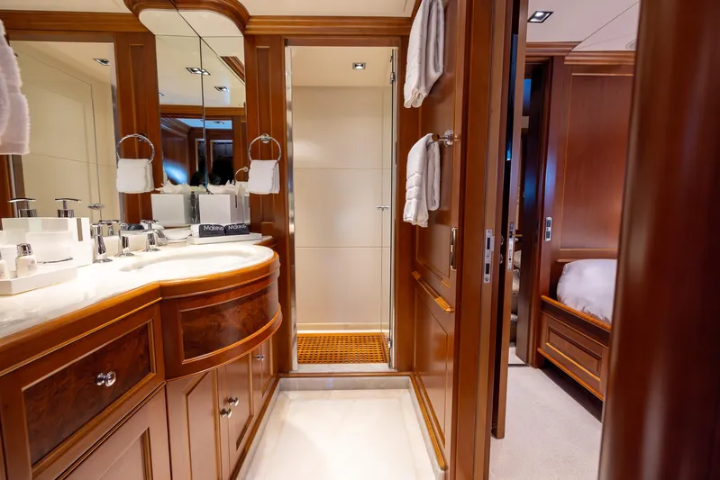 Benetti Classic Yacht Photos Pics Luxurious bathroom on 2008 Benetti Classic yacht with wooden cabinetry and modern fixtures.