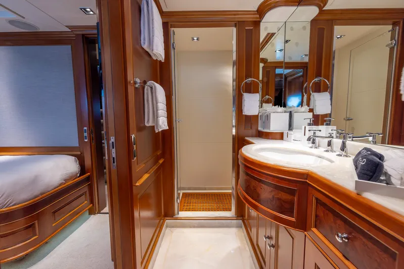 Benetti Classic Yacht Photos Pics Luxurious bathroom on 2008 Benetti Classic yacht with elegant wood finishes and modern fixtures.