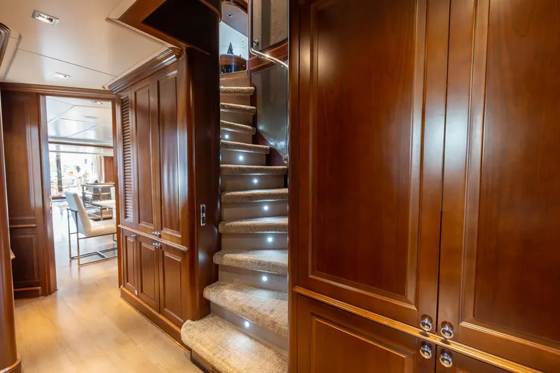 Benetti Classic Yacht Photos Pics Luxurious wooden interior of 2008 Benetti Classic yacht with elegant staircase and ambient lighting.