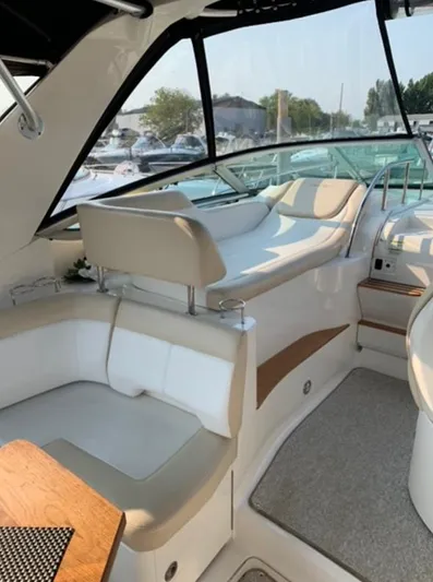  Yacht Photos Pics 2013 Sea Ray 350 Sundancer interior with beige seating and wooden accents.