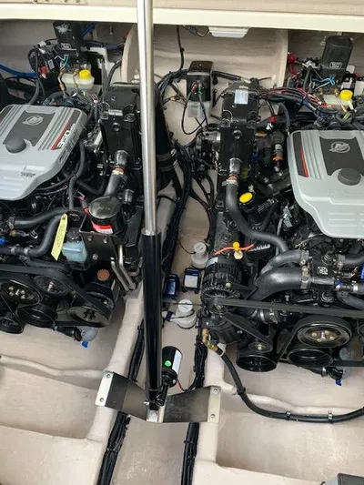  Yacht Photos Pics Engine compartment of a 2013 Sea Ray 350 Sundancer boat, showcasing dual engines.