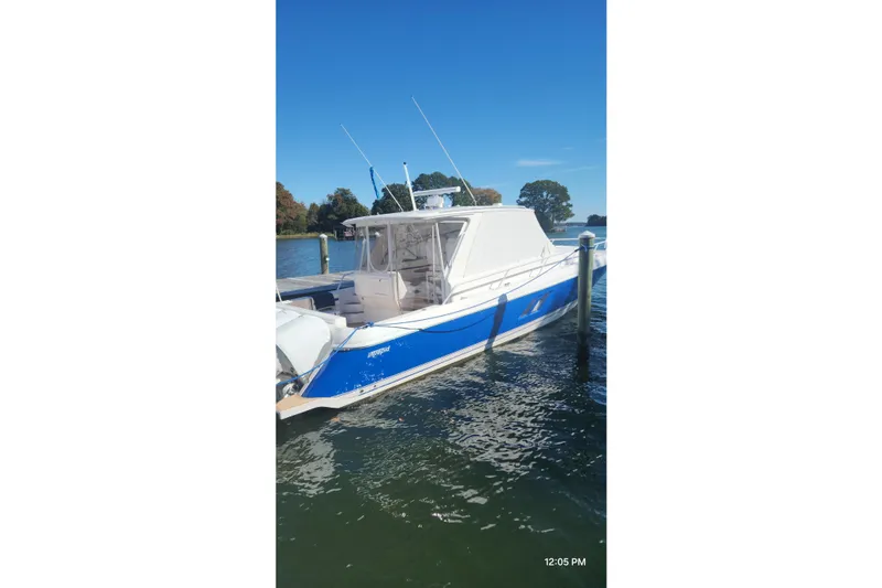  Yacht Photos Pics 2017 Intrepid 475 Sport Yacht docked on a sunny day.