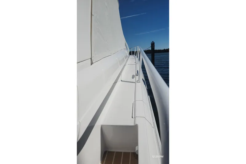  Yacht Photos Pics Side view of a 2017 Intrepid 475 Sport Yacht, showcasing sleek white design.
