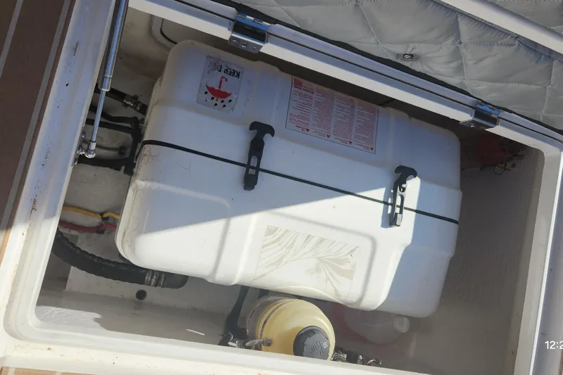  Yacht Photos Pics Storage compartment of a 2017 Intrepid 475 Sport Yacht with equipment and containers.