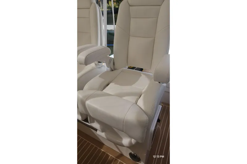  Yacht Photos Pics Luxurious seating on 2017 Intrepid 475 Sport Yacht, featuring plush white upholstery.