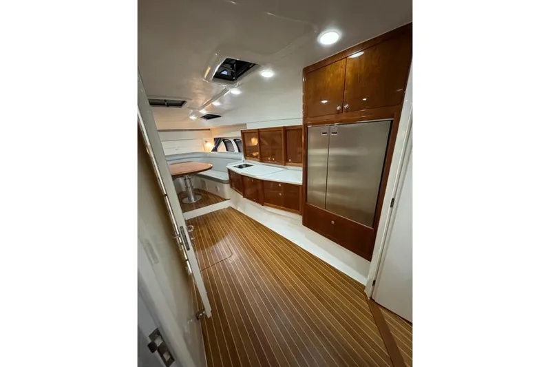  Yacht Photos Pics Interior of 2017 Intrepid 475 Sport Yacht with wood flooring and modern cabinetry.