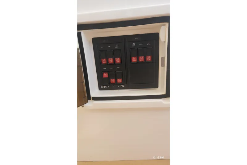  Yacht Photos Pics Control panel of a 2017 Intrepid 475 Sport Yacht with labeled switches.