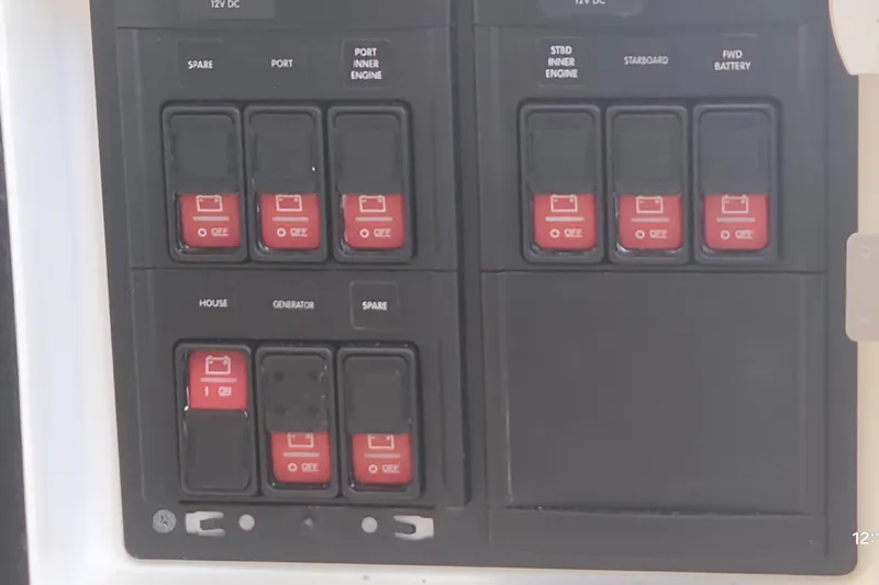  Yacht Photos Pics Control panel of a 2017 Intrepid 475 Sport Yacht with labeled switches.