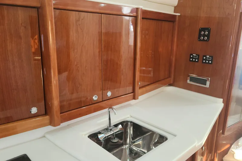  Yacht Photos Pics Luxurious wooden yacht interior with sink, Intrepid 475 Sport Yacht, 2017 model.