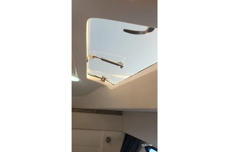  Yacht Photos Pics Skylight view from 2017 Intrepid 475 Sport Yacht interior, showcasing clear sky.