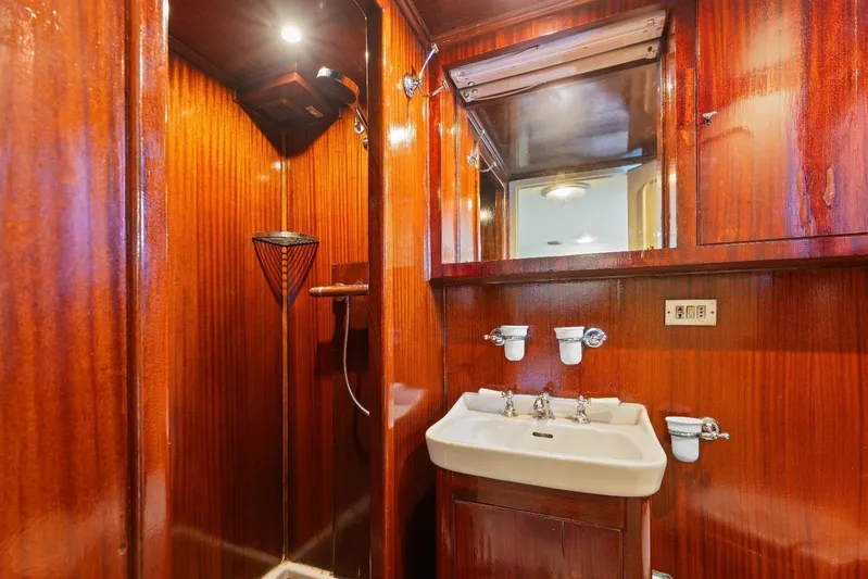 Daylami Yacht Photos Pics Luxurious wooden bathroom interior on a 1972 Benetti Yachts Classic model.