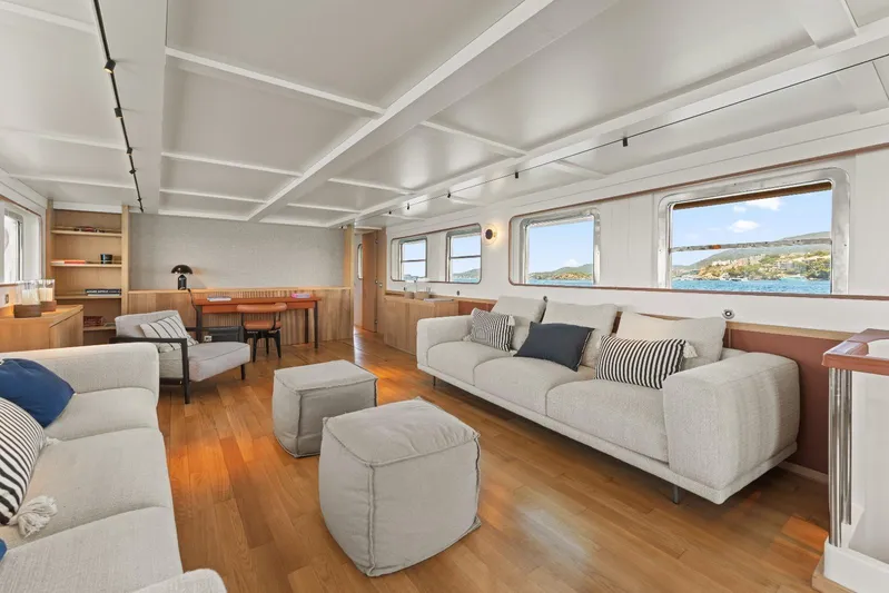 Daylami Yacht Photos Pics Luxurious interior of a 1972 Benetti Yachts Classic, featuring elegant seating and ocean views.