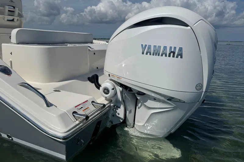  Yacht Photos Pics 2023 Cobia 280 Center Console with Yamaha outboard engine in shallow water.