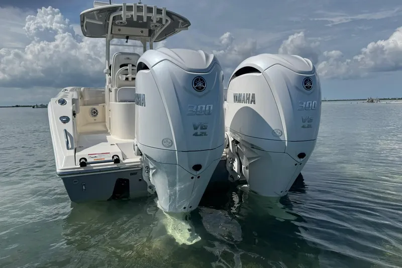  Yacht Photos Pics 2023 Cobia 280 Center Console boat with twin Yamaha 300 engines in shallow water.