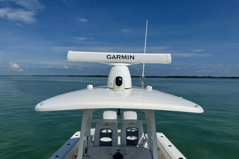 Yacht Photos Pics 2023 Cobia 280 Center Console boat with Garmin radar on calm water.