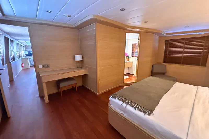 Celebrity Yacht Photos Pics Luxurious 2001 Ses Yachts custom bedroom with wooden interior and modern furnishings.