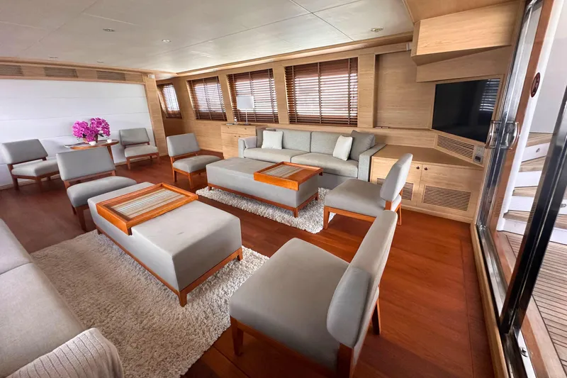 Celebrity Yacht Photos Pics Luxurious yacht interior with modern seating, wooden accents, and natural light. Ses Yachts custom, 2001.
