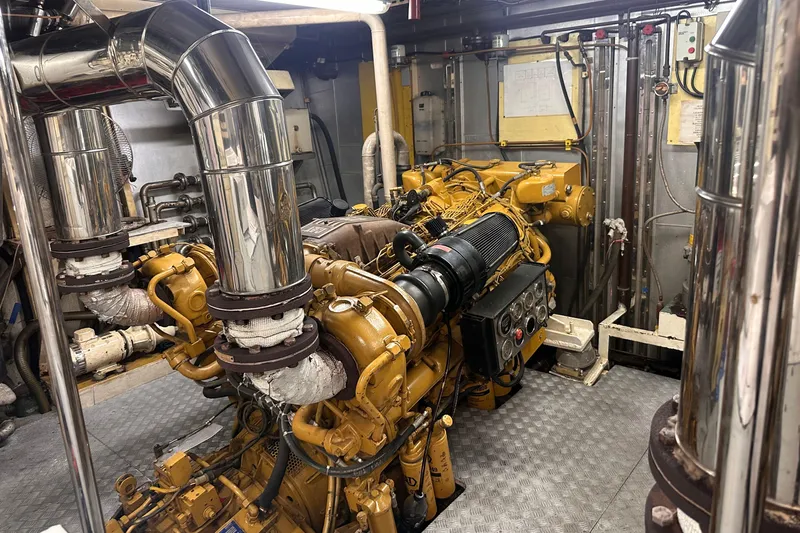 Celebrity Yacht Photos Pics Engine room of a 2001 Ses Yachts custom model, featuring complex machinery and piping.