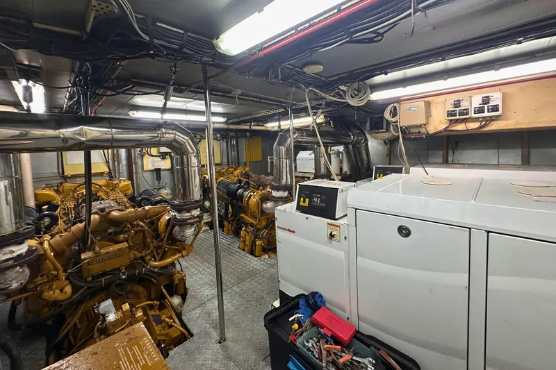 Celebrity Yacht Photos Pics Engine room of 2001 Ses Yachts custom model, featuring machinery and tools.