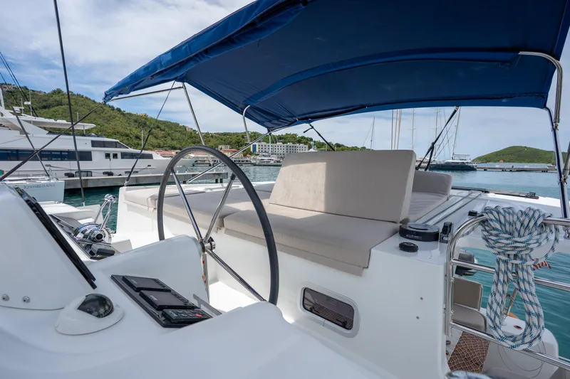 Starry Night Yacht Photos Pics Luxurious 2022 Lagoon 46 catamaran with spacious deck and modern helm station.