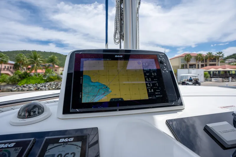 Starry Night Yacht Photos Pics Navigation system on a 2022 Lagoon 46 catamaran, displaying nautical charts and data.
