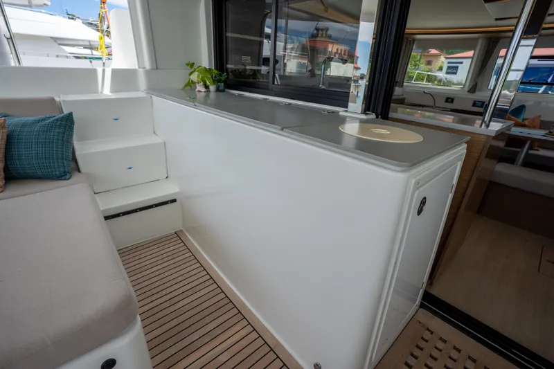 Starry Night Yacht Photos Pics Interior view of 2022 Lagoon 46 catamaran, featuring modern seating and sleek design elements.