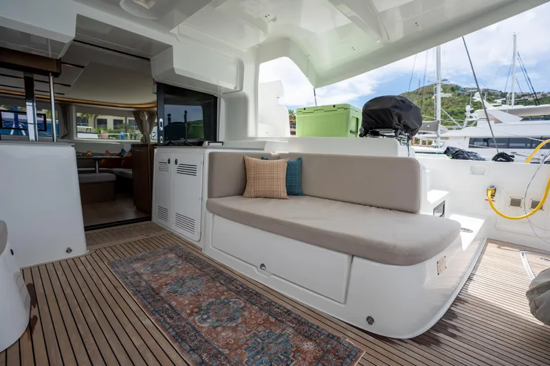 Starry Night Yacht Photos Pics Luxurious Lagoon 46 yacht interior with comfortable seating, elegant decor, and scenic marina view.