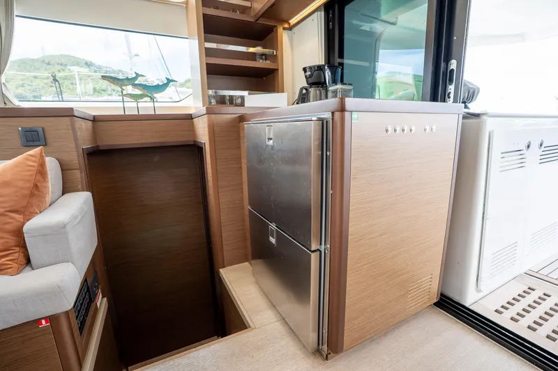 Starry Night Yacht Photos Pics Modern kitchen area in a 2022 Lagoon 46 yacht with stainless steel appliances.