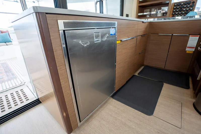 Starry Night Yacht Photos Pics Modern kitchen area on a 2022 Lagoon 46 yacht with stainless steel appliances.