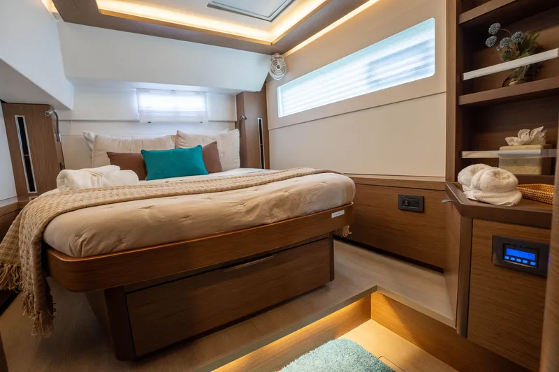 Starry Night Yacht Photos Pics Luxurious interior of a 2022 Lagoon 46 yacht, featuring a cozy bedroom with modern amenities.