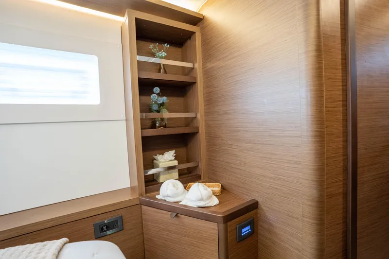 Starry Night Yacht Photos Pics Luxurious interior of 2022 Lagoon 46 yacht with wooden shelves and decor elements.