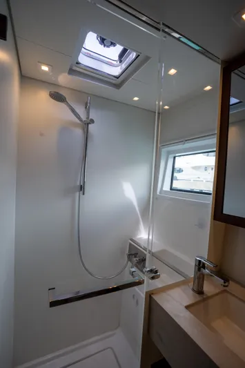 Starry Night Yacht Photos Pics Modern bathroom in 2022 Lagoon 46 yacht with shower and skylight.