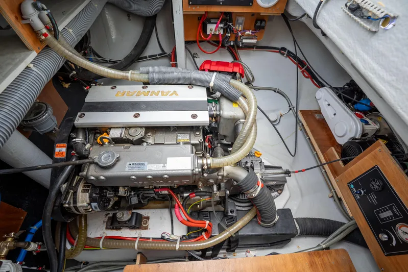 Starry Night Yacht Photos Pics Engine compartment of a 2022 Lagoon 46 yacht, featuring a Yanmar engine and various components.