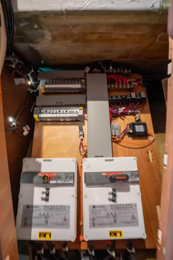 Starry Night Yacht Photos Pics Electrical panel inside a 2022 Lagoon 46 yacht, showcasing circuit breakers and wiring.