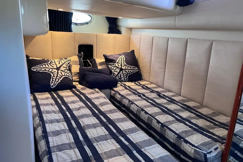 Yacht Photos Pics Interior of 2006 Fairline Targa 40 yacht with twin beds and nautical decor.
