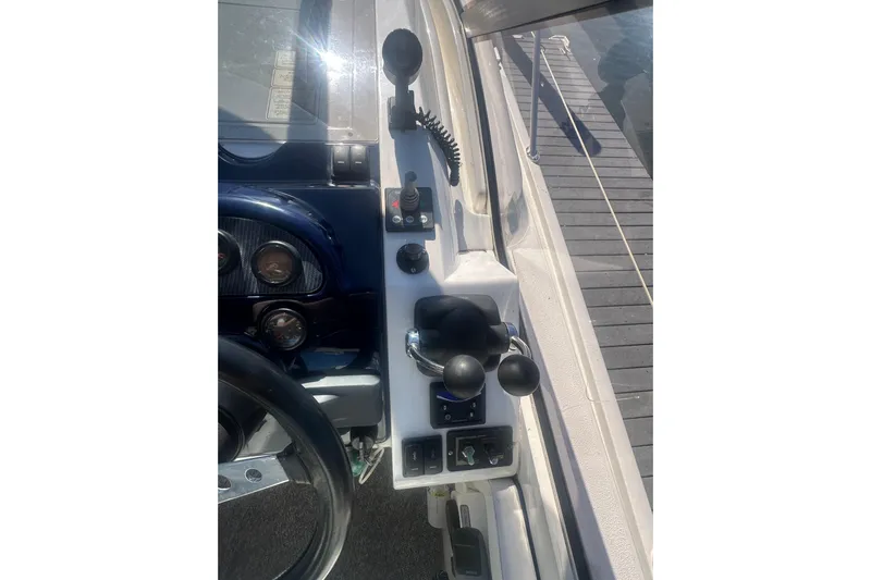  Yacht Photos Pics Control panel of a 2006 Fairline Targa 40 yacht, featuring steering and throttle controls.