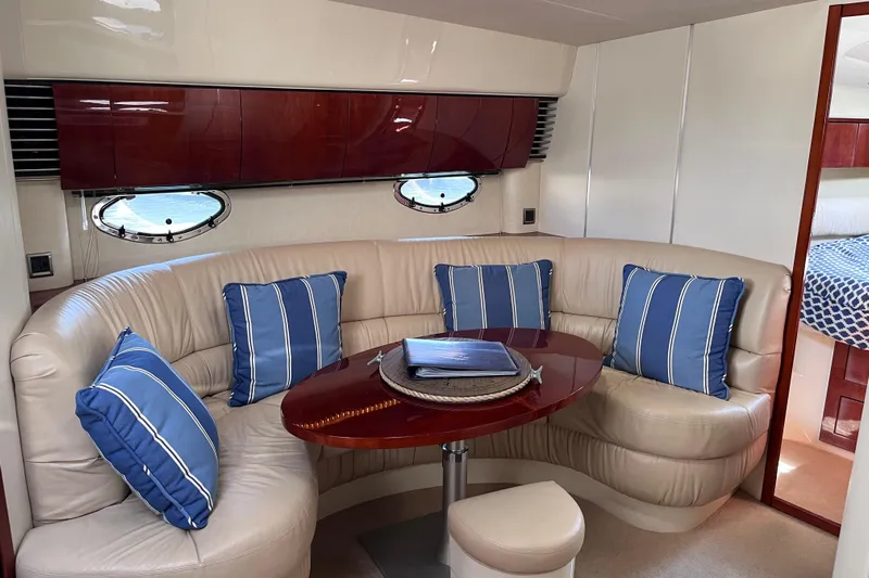  Yacht Photos Pics Luxurious 2006 Fairline Targa 40 yacht interior with plush seating and blue-striped cushions.
