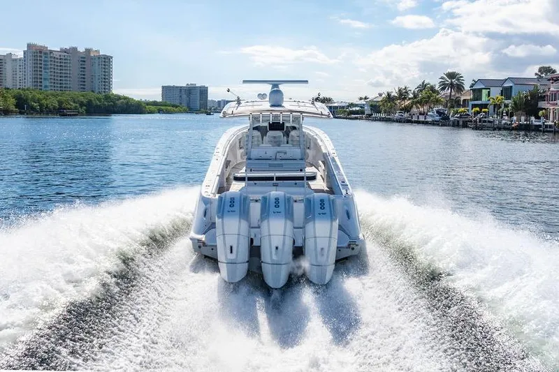  Yacht Photos Pics 2024 HCB 42 Lujo boat cruising on a scenic waterway with powerful engines.
