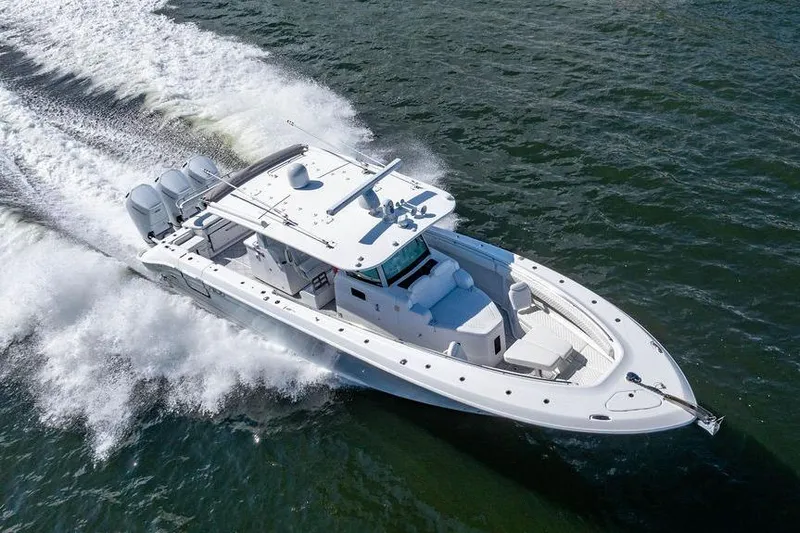  Yacht Photos Pics 2024 HCB 42 Lujo boat cruising on open water, showcasing sleek design and powerful engines.